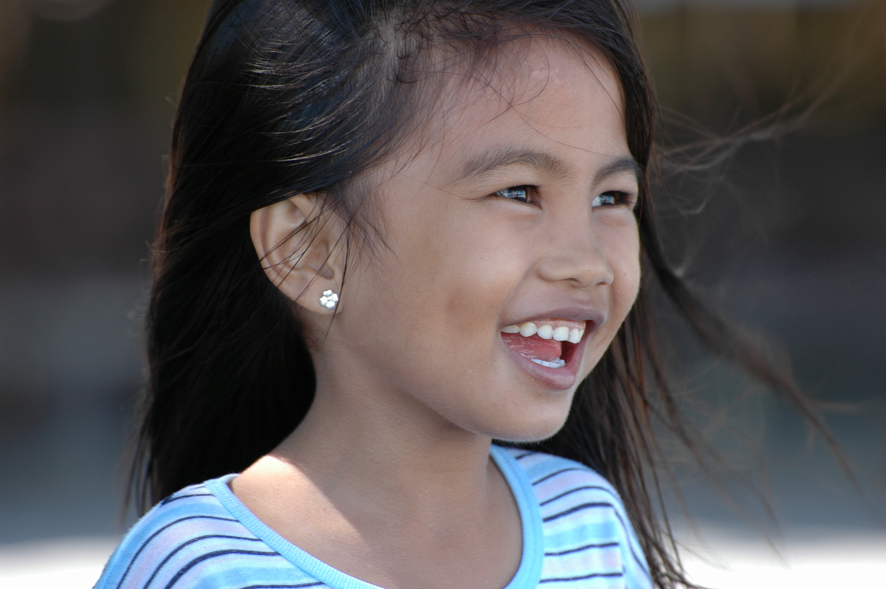 Philippines, Mindanao, Young girl smiling. 